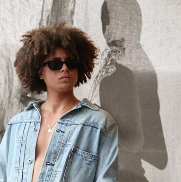 Juay Kennedy in denim, daylight portrait